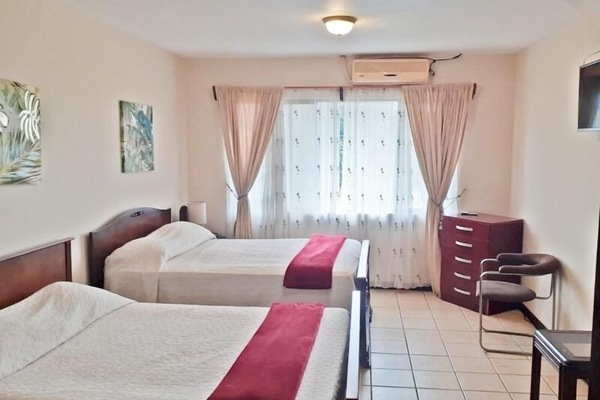 Quadruple Room | Down comforters, pillowtop beds, individually furnished, blackout drapes
