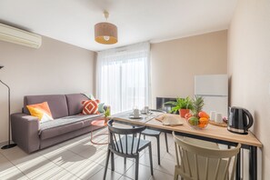 Apartment, 2 Bedrooms | Living area | LCD TV - Appart'City Confort Toulouse Aéroport Cornebarrieu (Cornebarrieu)