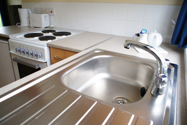 Microwave, electric kettle, cookware/dishes/utensils