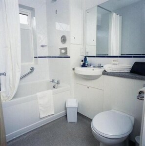Combined shower/bathtub, deep-soaking bathtub, towels