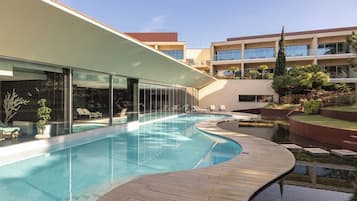 Indoor pool, seasonal outdoor pool, pool umbrellas, sun loungers