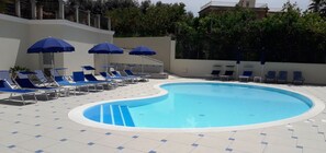 Outdoor pool, pool umbrellas, pool loungers