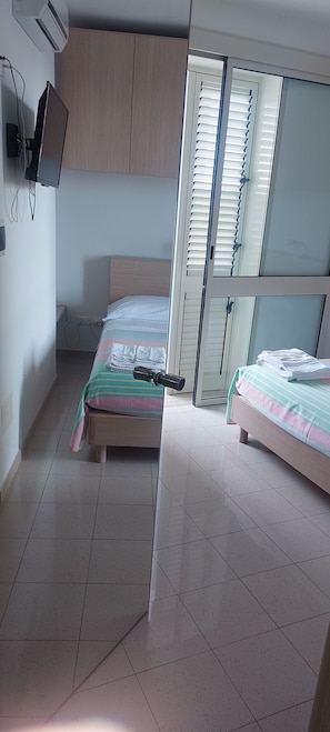 Economy Room, 1 Double Bed | 2 bedrooms, in-room safe, free WiFi, bed sheets
