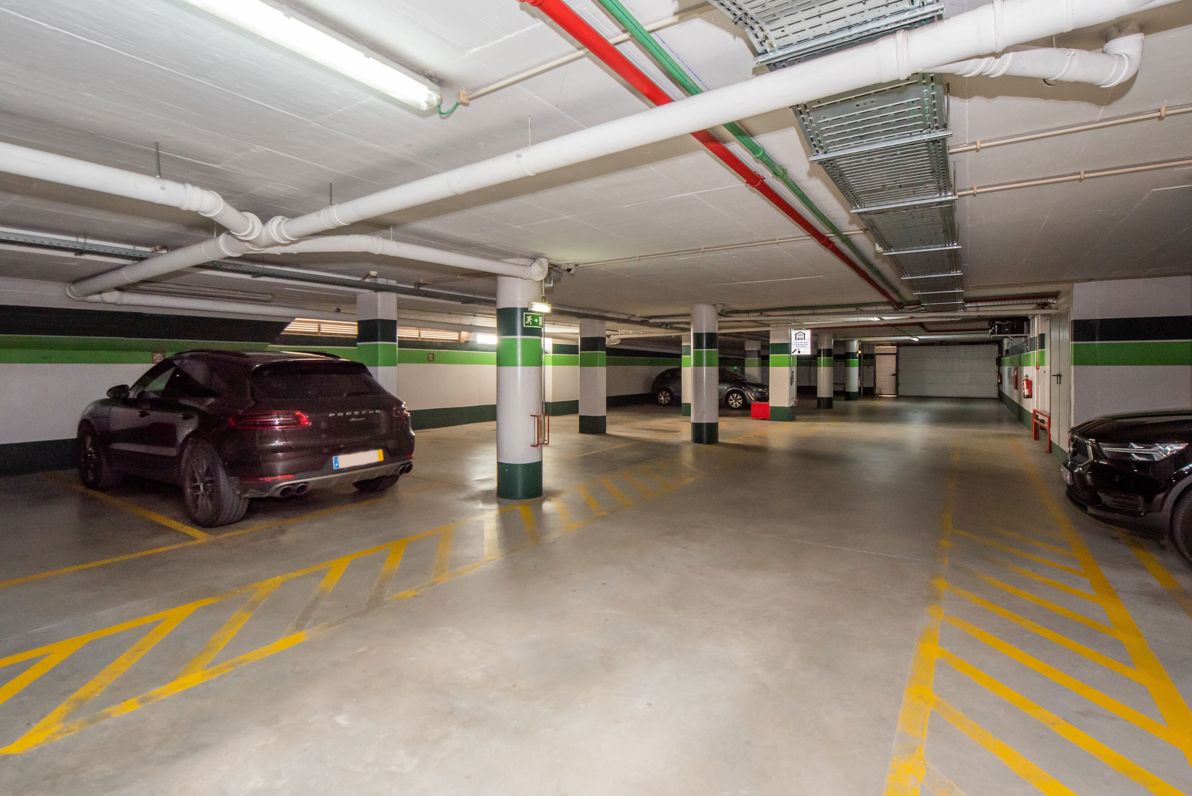 A multi-level parking garage with cars parked on different levels.