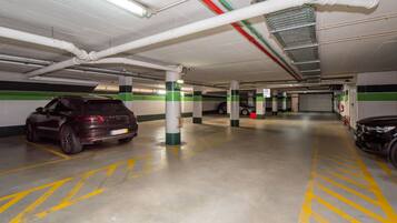 A multi-level parking garage with cars parked on different levels.