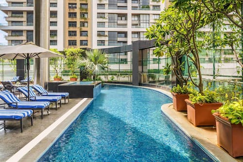 Outdoor pool, open 6:00 AM to 8:00 PM, pool umbrellas, pool loungers