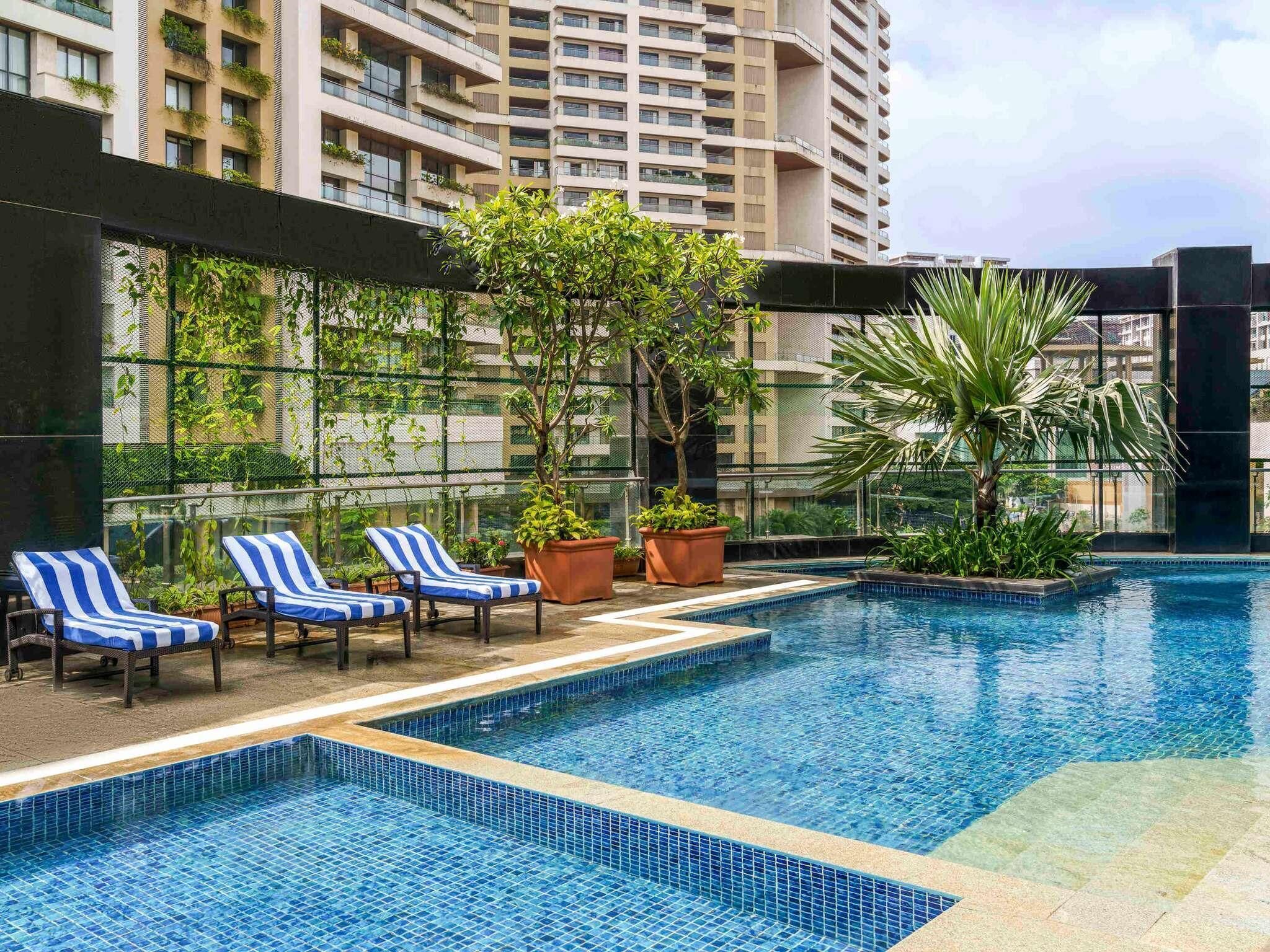 Outdoor pool, open 6:00 AM to 8:00 PM, pool umbrellas, pool loungers