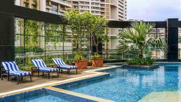 Outdoor pool, open 6:00 AM to 8:00 PM, pool umbrellas, pool loungers