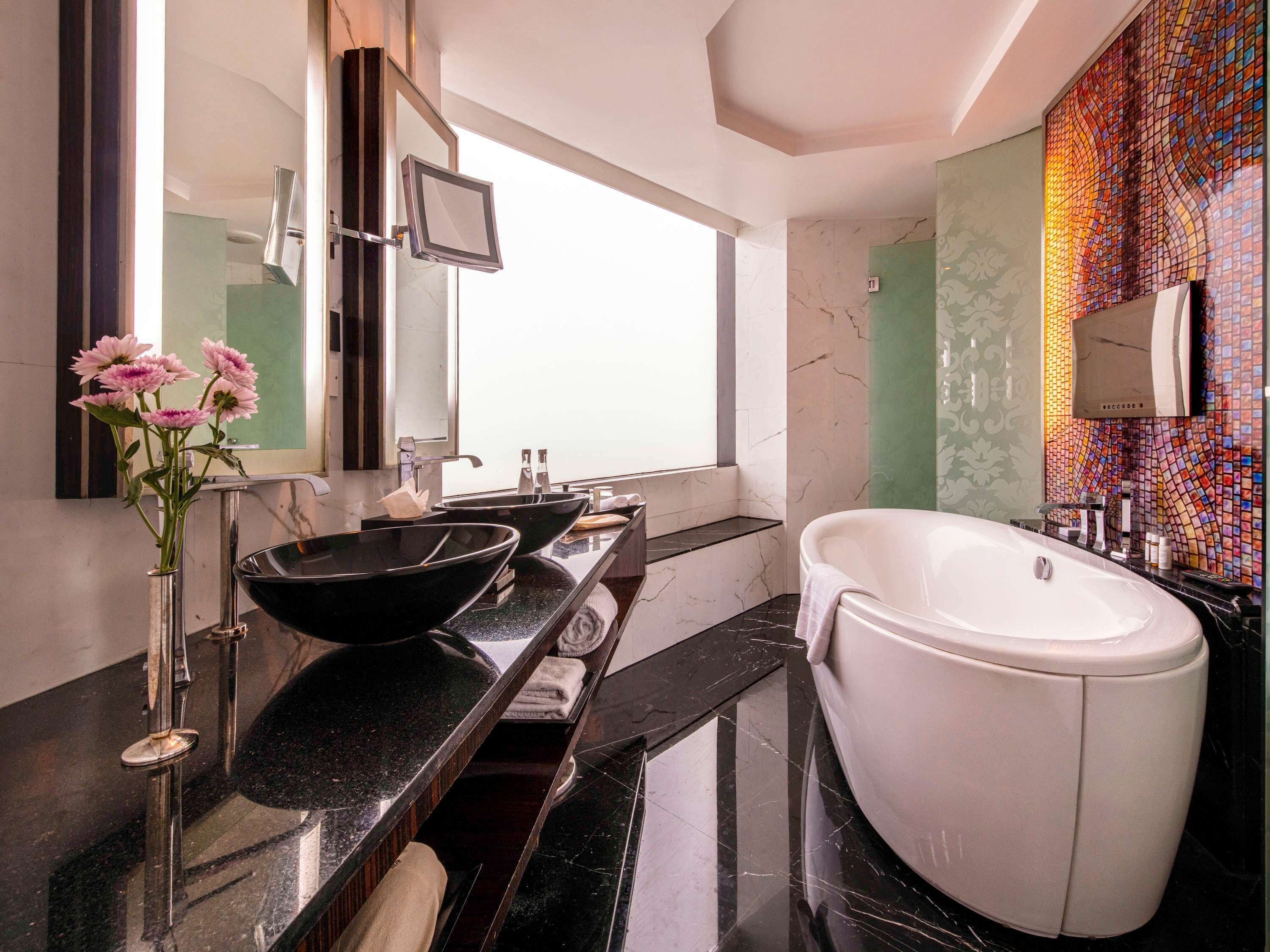 separate bathtub and shower, deep-soaking bathtub, rainfall showerhead