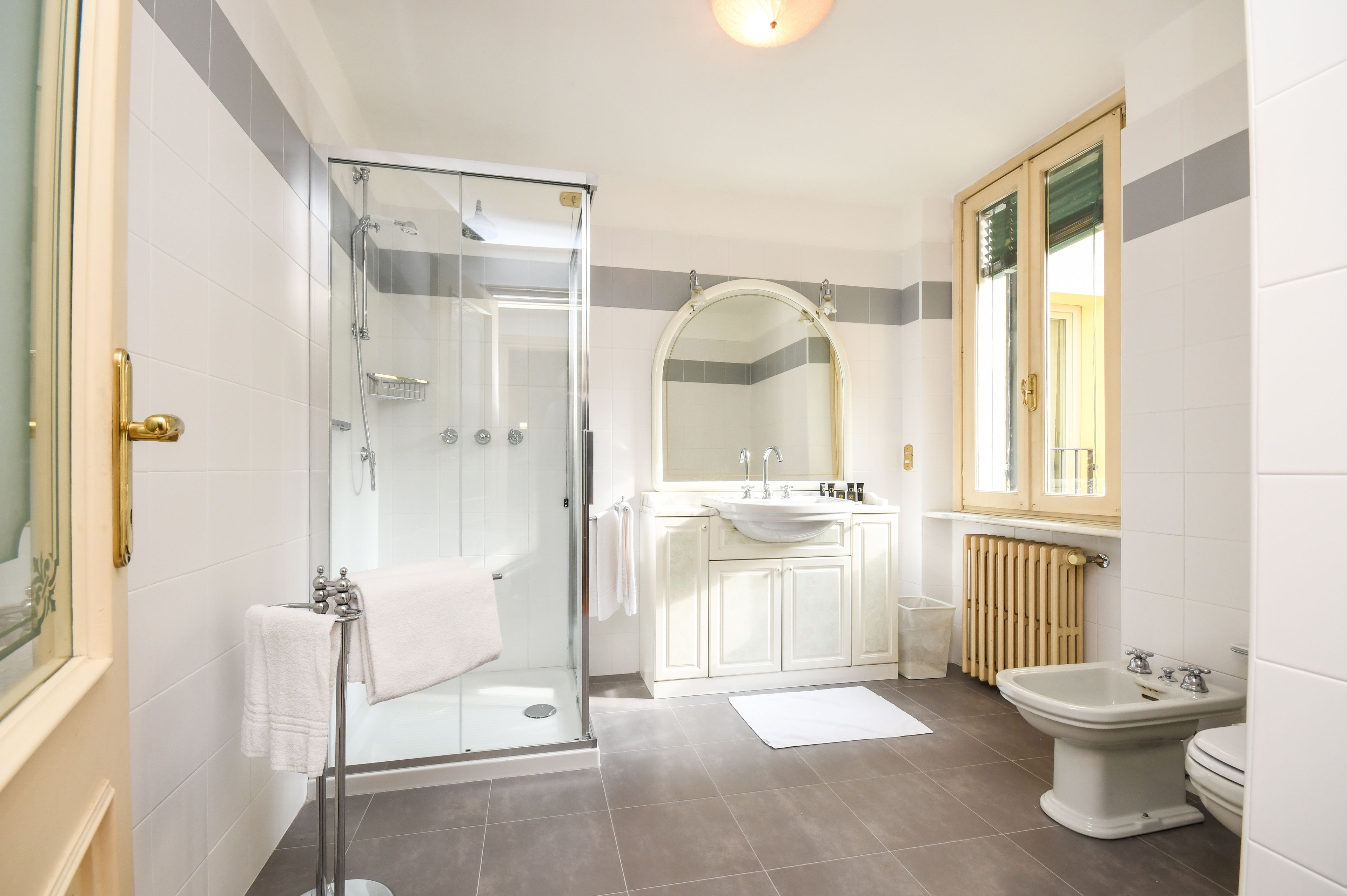 city apartment, 1 bedroom, kitchen, annex building | bathroom | combined shower/bathtub, rainfall showerhead, designer toiletries