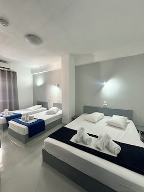 Basic Quadruple Room, 1 Bedroom | Blackout curtains, iron/ironing board, free WiFi, bed sheets - Sparta Team Hotel - Hostel (Athens)