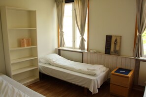 Triple Room, Shared Bathroom | Individually furnished, blackout curtains, free WiFi, bed sheets
