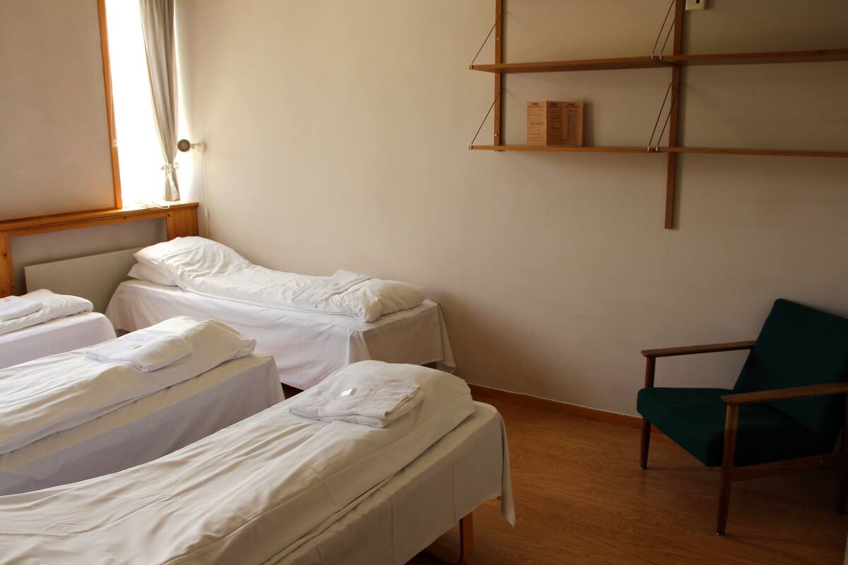Quadruple Room, Shared Bathroom | Individually furnished, blackout curtains, free WiFi, bed sheets
