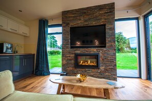 Luxury Bungalow, Hot Tub (Long Mynd Garden Room) | Living area | Flat-screen TV
