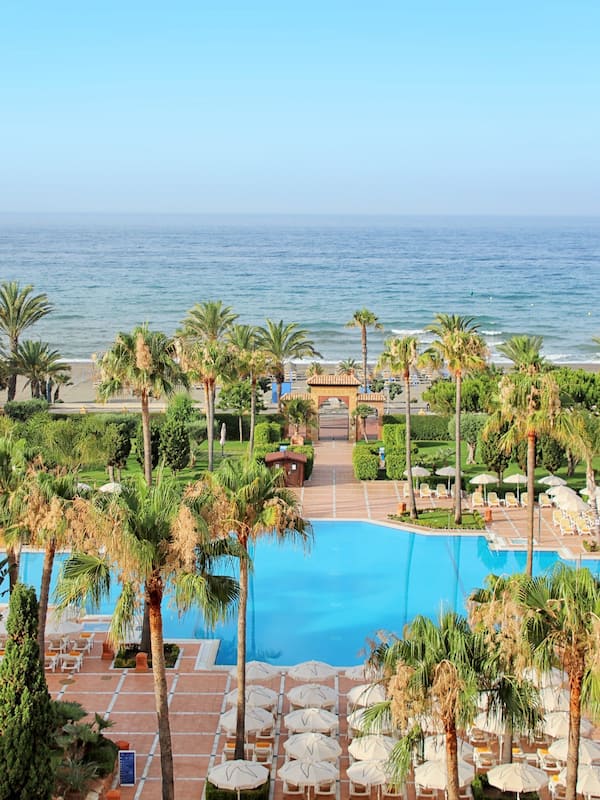 Indoor pool, outdoor pool, pool umbrellas, sun loungers