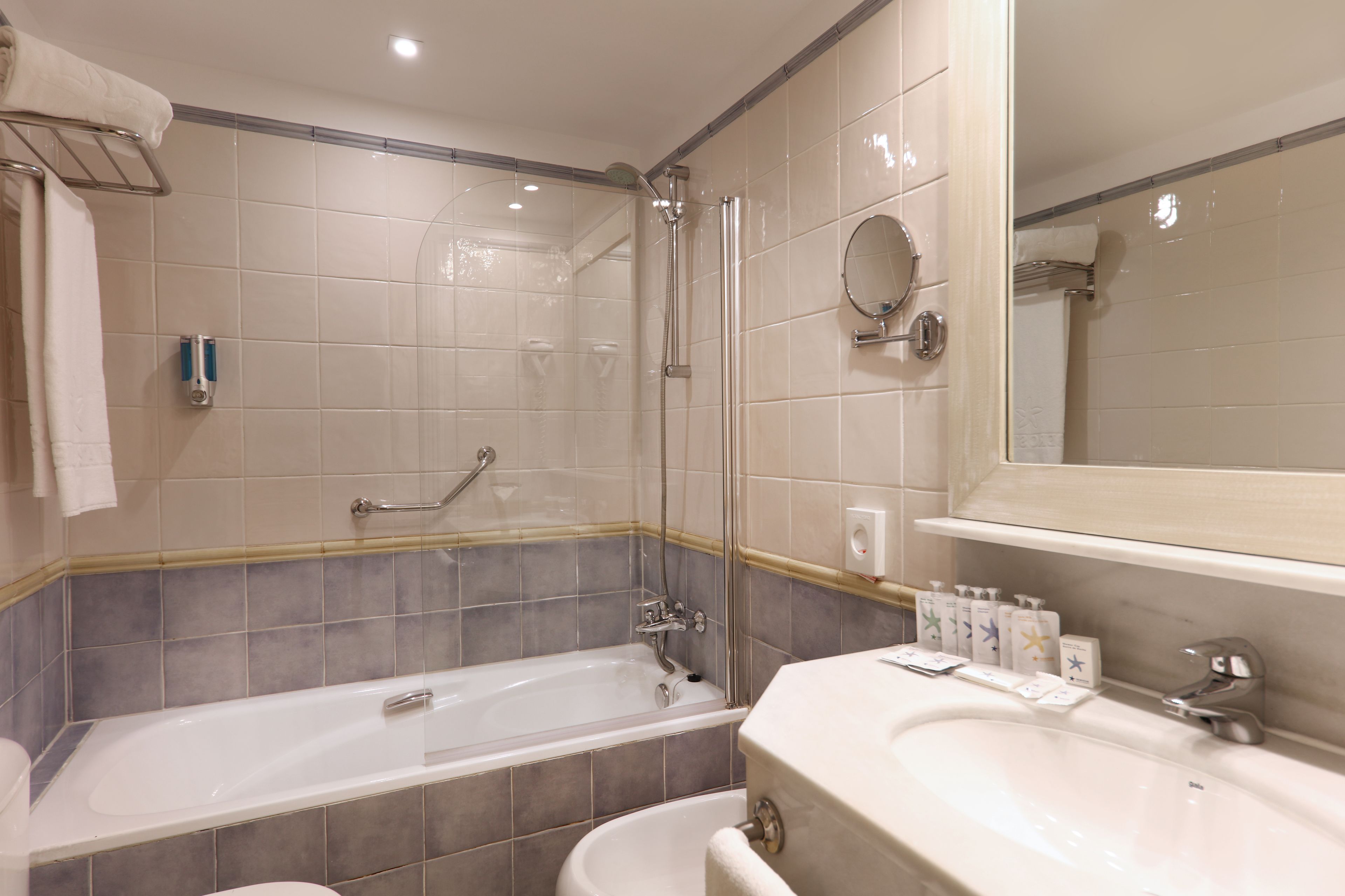 rainfall showerhead, eco-friendly toiletries, hair dryer, towels