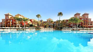 Indoor pool, outdoor pool, pool umbrellas, pool loungers