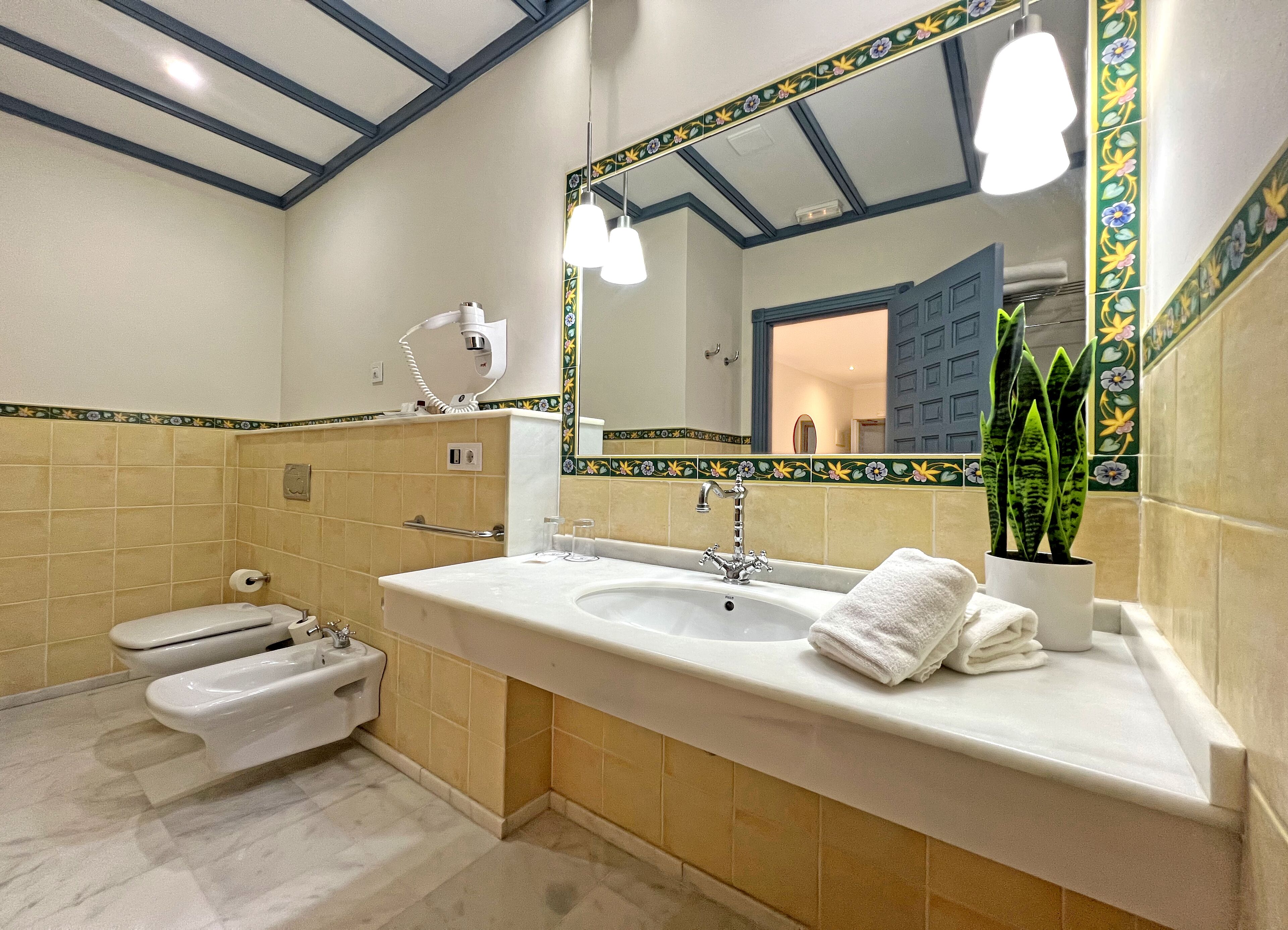 triple room, 1 queen bed with sofa bed | bathroom | free toiletries, hair dryer, towels