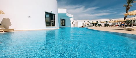 Outdoor pool, pool umbrellas, sun loungers