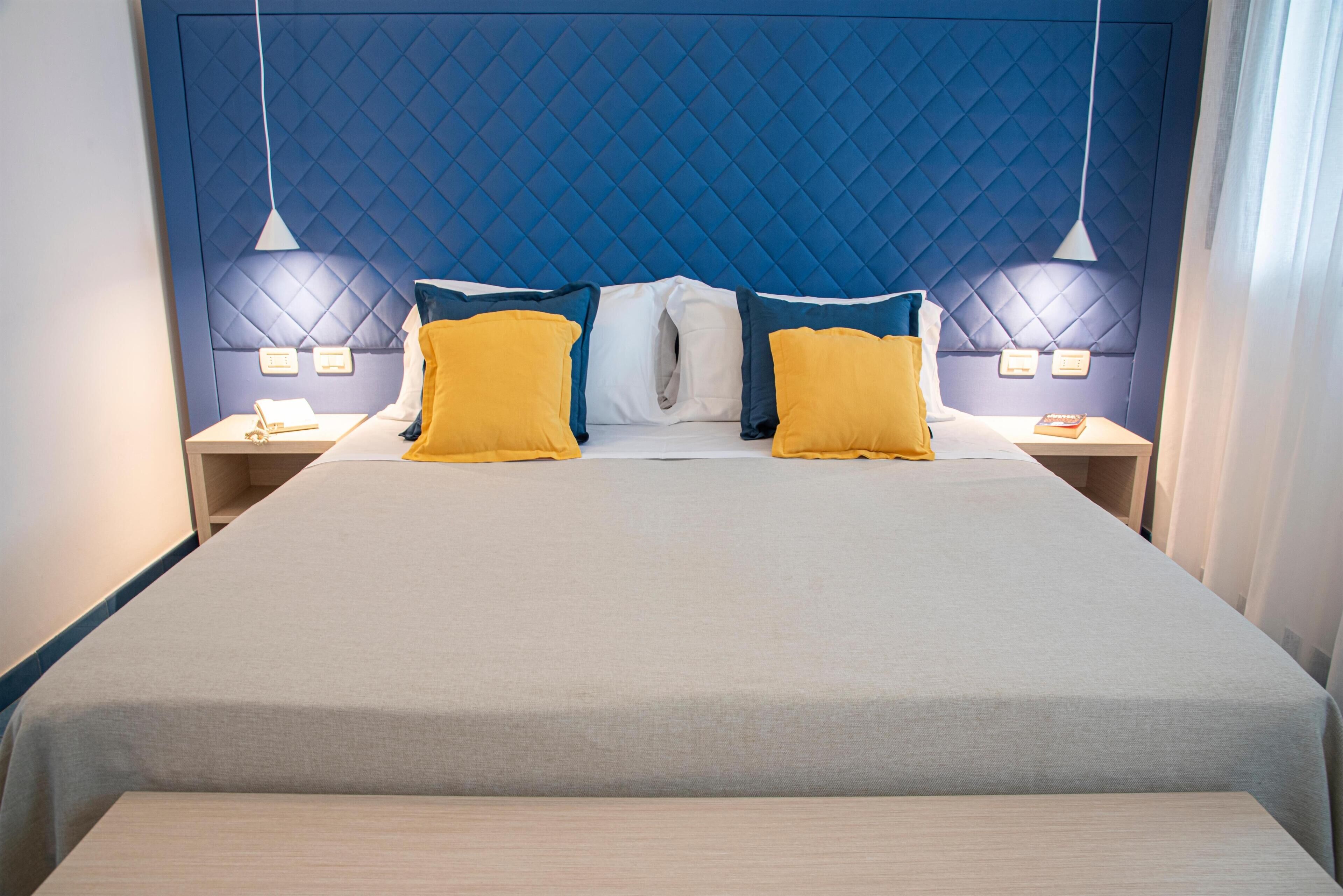 Suite Deluxe, vistas al mar (Quadrupla) | Minibar, caja fuerte, escritorio y wifi gratis