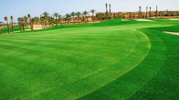 Enjoy a serene golfing experience on this well-maintained course with lush fairways and challenging sand bunkers.