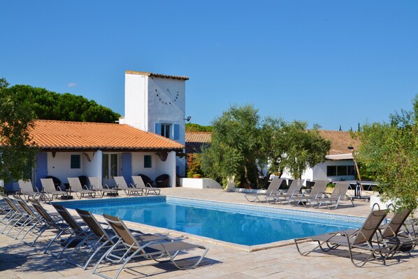 Outdoor pool, open 9:00 AM to 9:00 PM, pool loungers