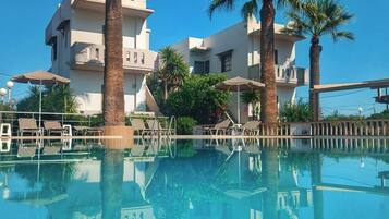Outdoor pool, open 8:00 AM to 7:00 PM, pool umbrellas, pool loungers