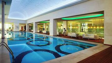 Indoor pool, seasonal outdoor pool, pool umbrellas, pool loungers