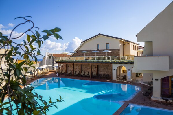 Indoor pool, seasonal outdoor pool, pool umbrellas, sun loungers