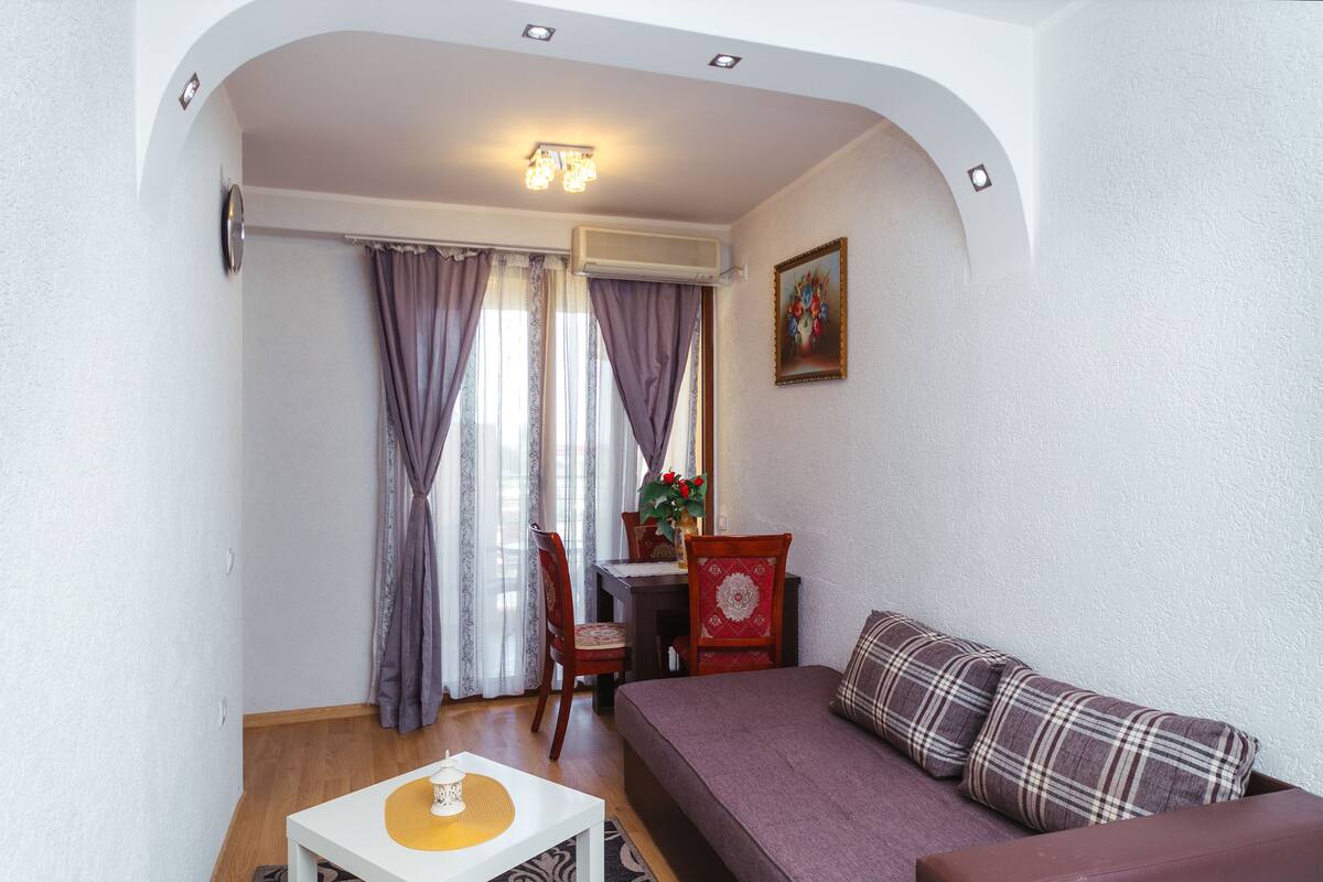 Family Apartment, 1 Bedroom, Courtyard View | Living room | 32-inch LED TV with satellite channels, TV