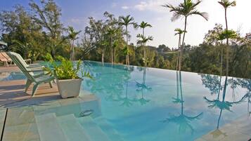 Outdoor pool, pool umbrellas, pool loungers