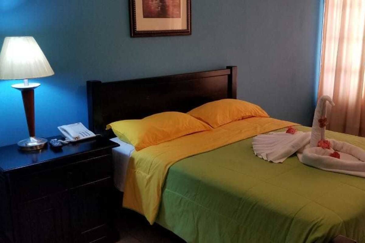 Standard Room, 1 Queen Bed | Minibar, in-room safe, desk, blackout curtains