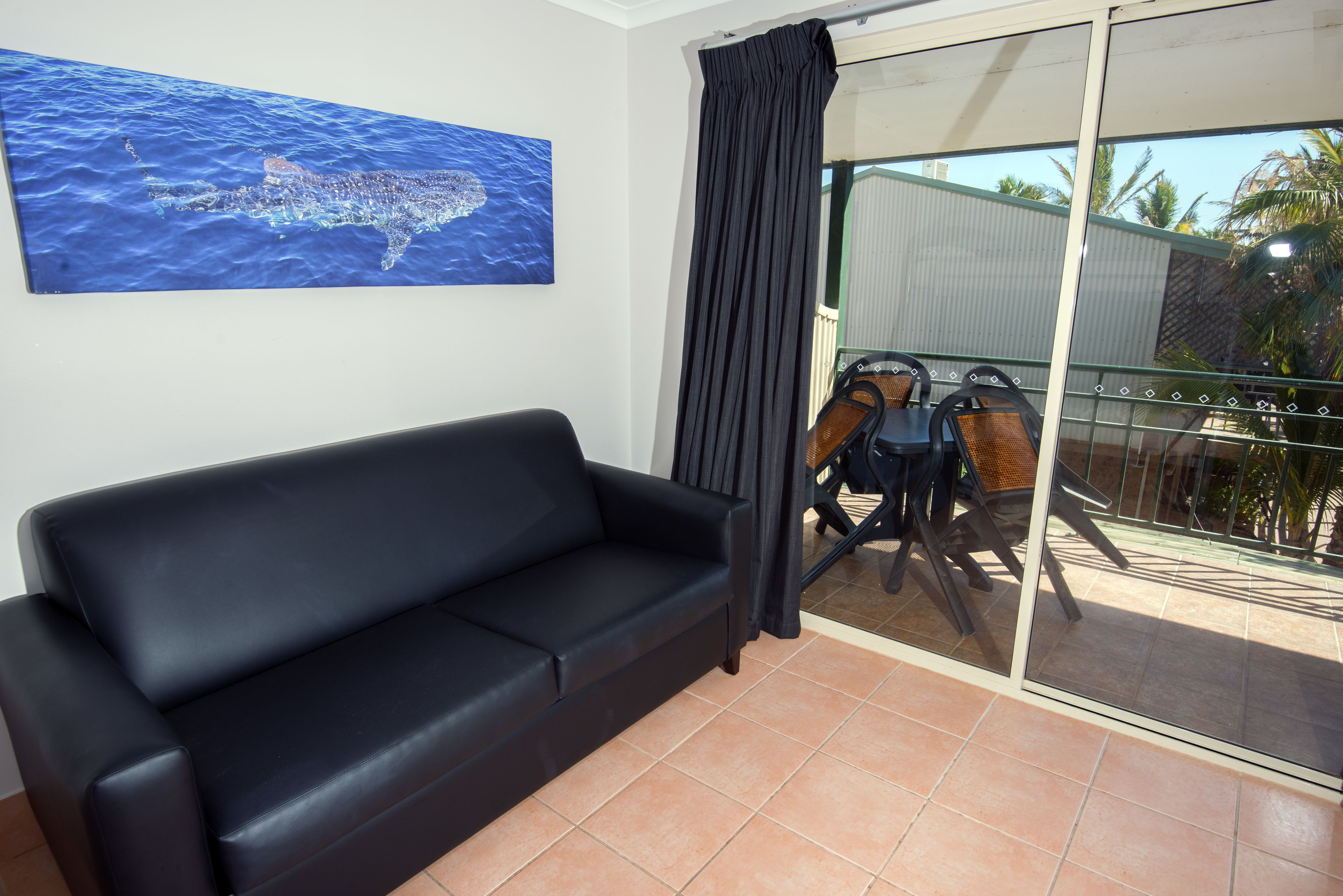 garden view apartment | desk, blackout curtains, iron/ironing board, cots/infant beds