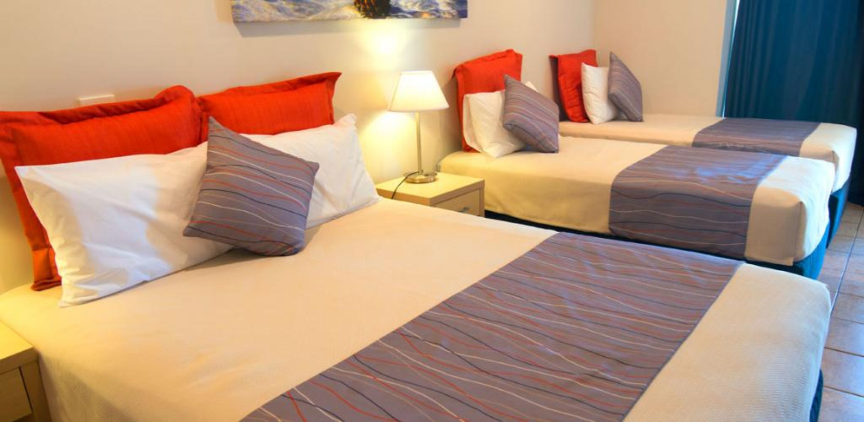 beachcomber studio unit  | desk, blackout curtains, iron/ironing board, cots/infant beds