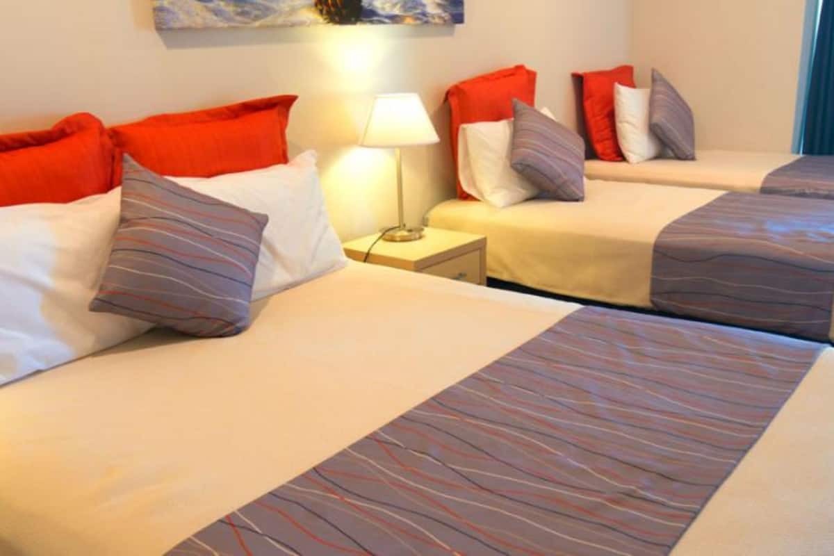 beachcomber studio unit  | desk, blackout curtains, iron/ironing board, cots/infant beds