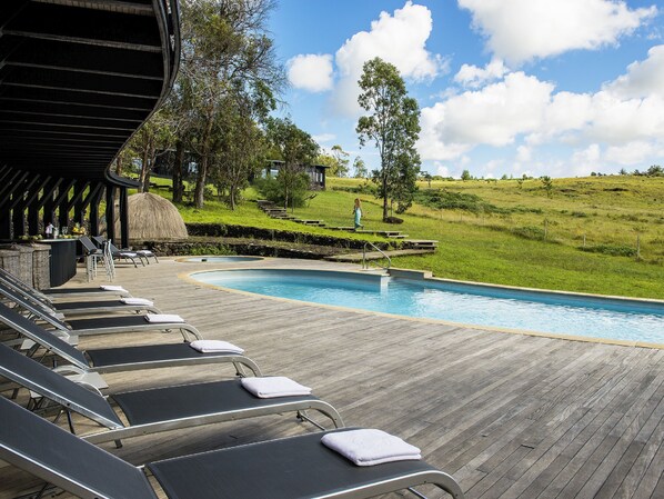 Outdoor pool, free cabanas, pool umbrellas