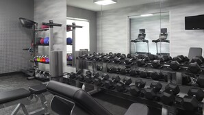 A gym with various exercise equipment, including dumbbells and a treadmill. - Fairfield Inn & Suites by Marriott Millville Vineland (Millville)