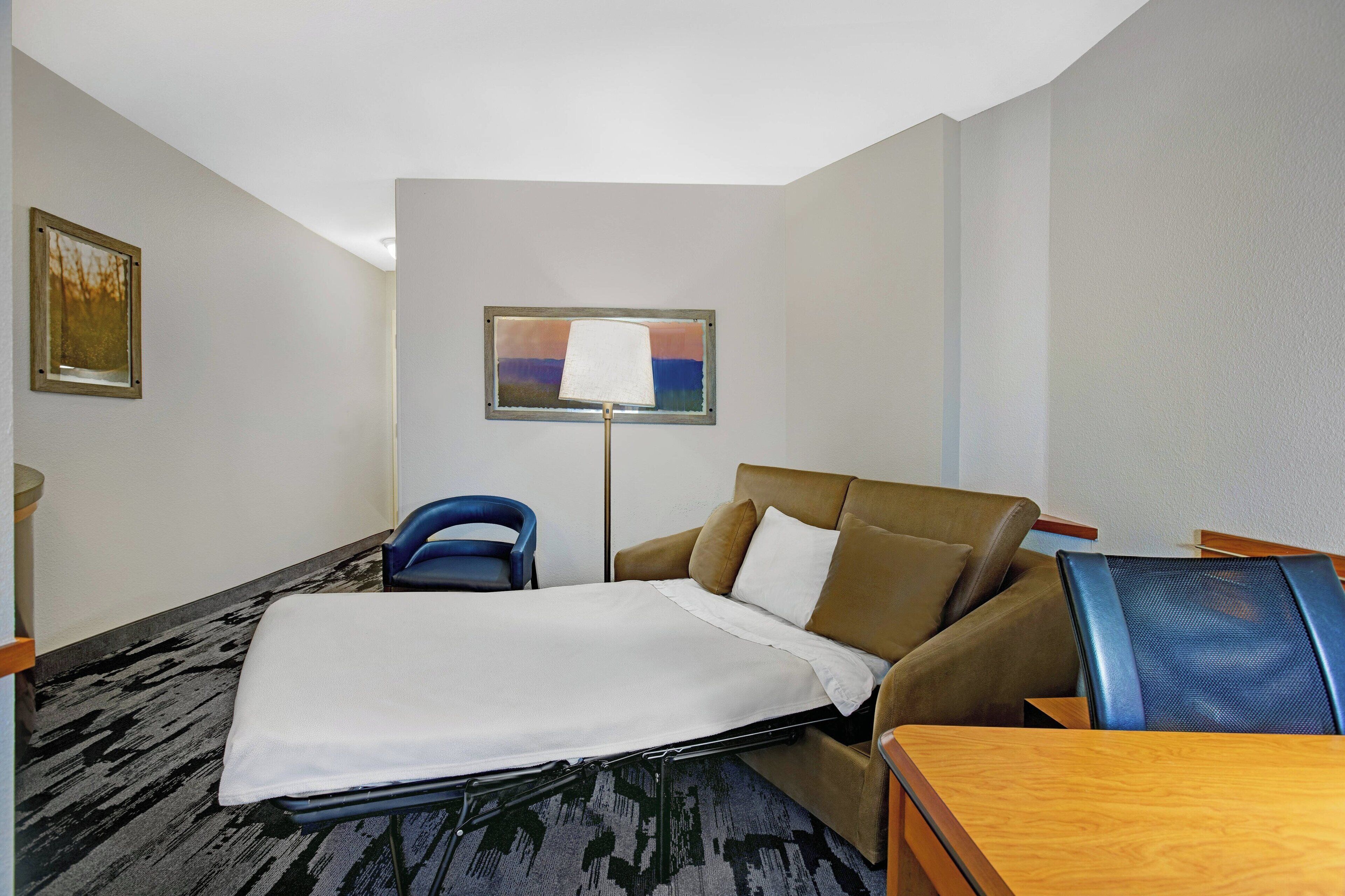 premium bedding, desk, laptop workspace, blackout curtains