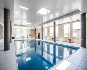 Indoor pool, open 6:00 AM to 11:00 PM, pool loungers