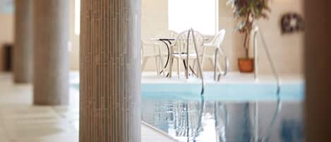 Indoor pool, open 6:00 AM to 11:00 PM, pool loungers