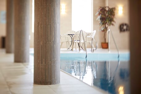 Indoor pool, open 6:00 AM to 11:00 PM, sun loungers