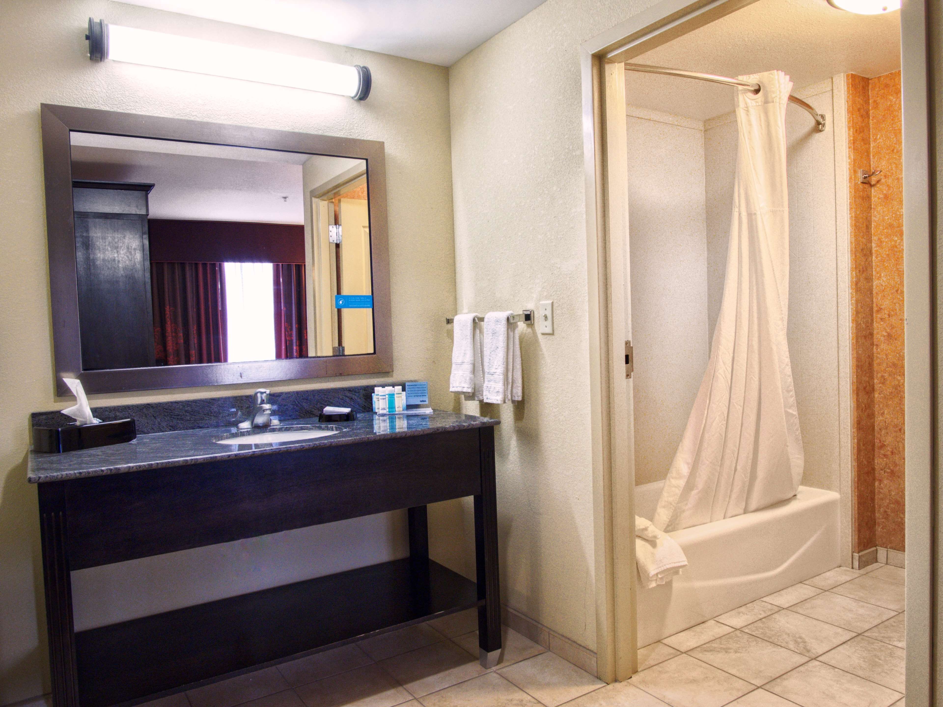 king studio suite | bathroom | hair dryer, towels, soap, shampoo