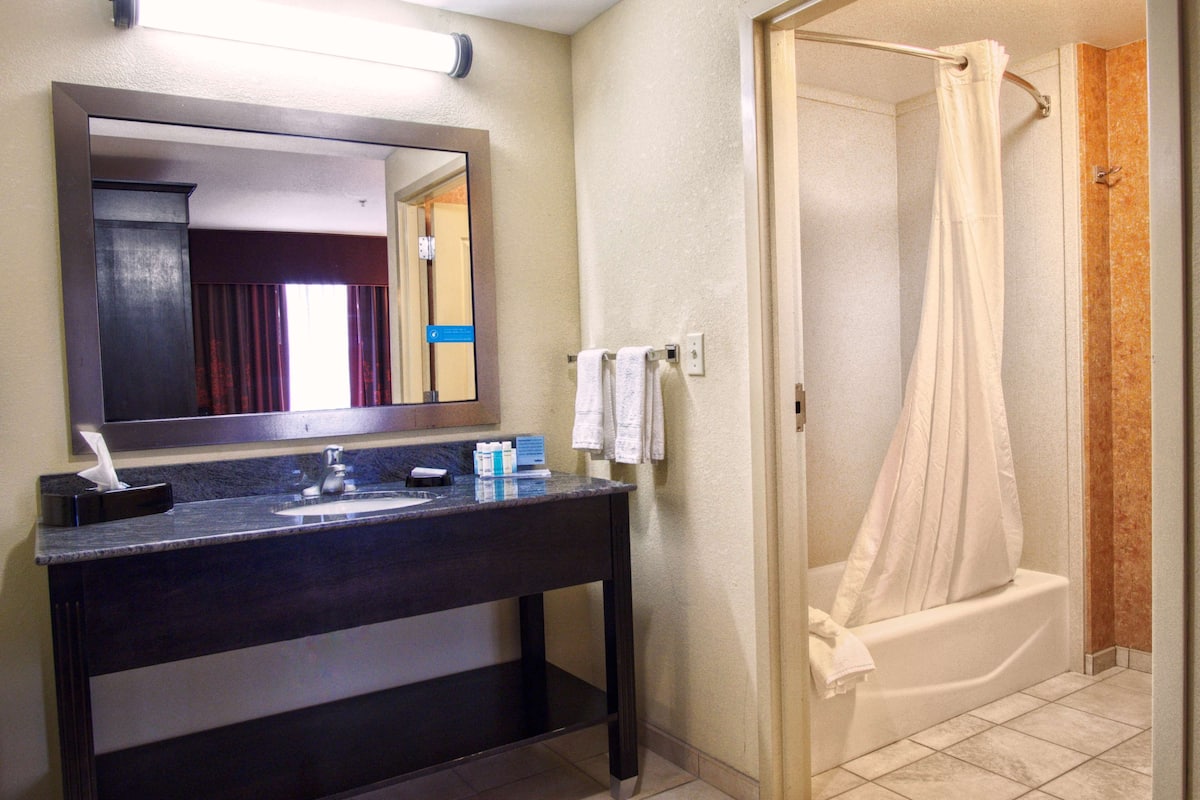 king studio suite | bathroom | hair dryer, towels, soap, shampoo