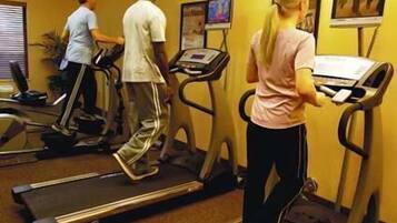 A gym with treadmills and exercise equipment.