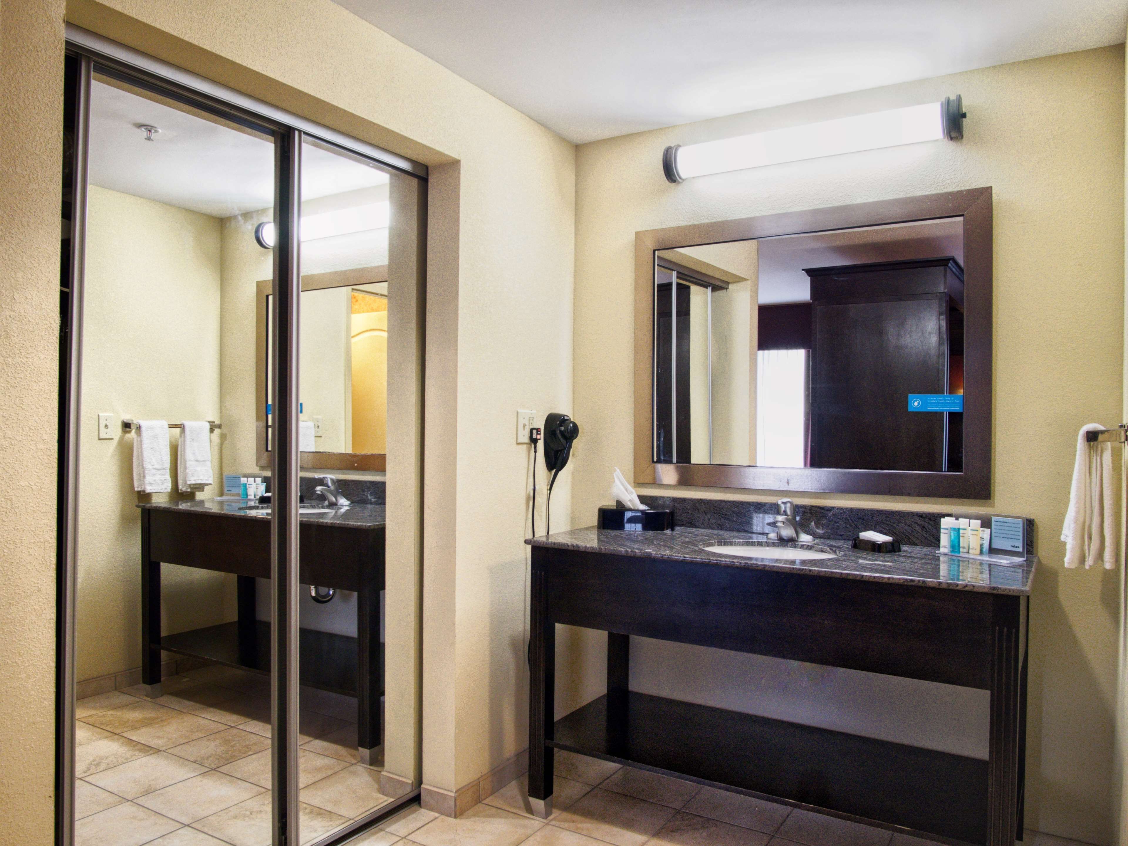 king studio suite | bathroom | hair dryer, towels, soap, shampoo