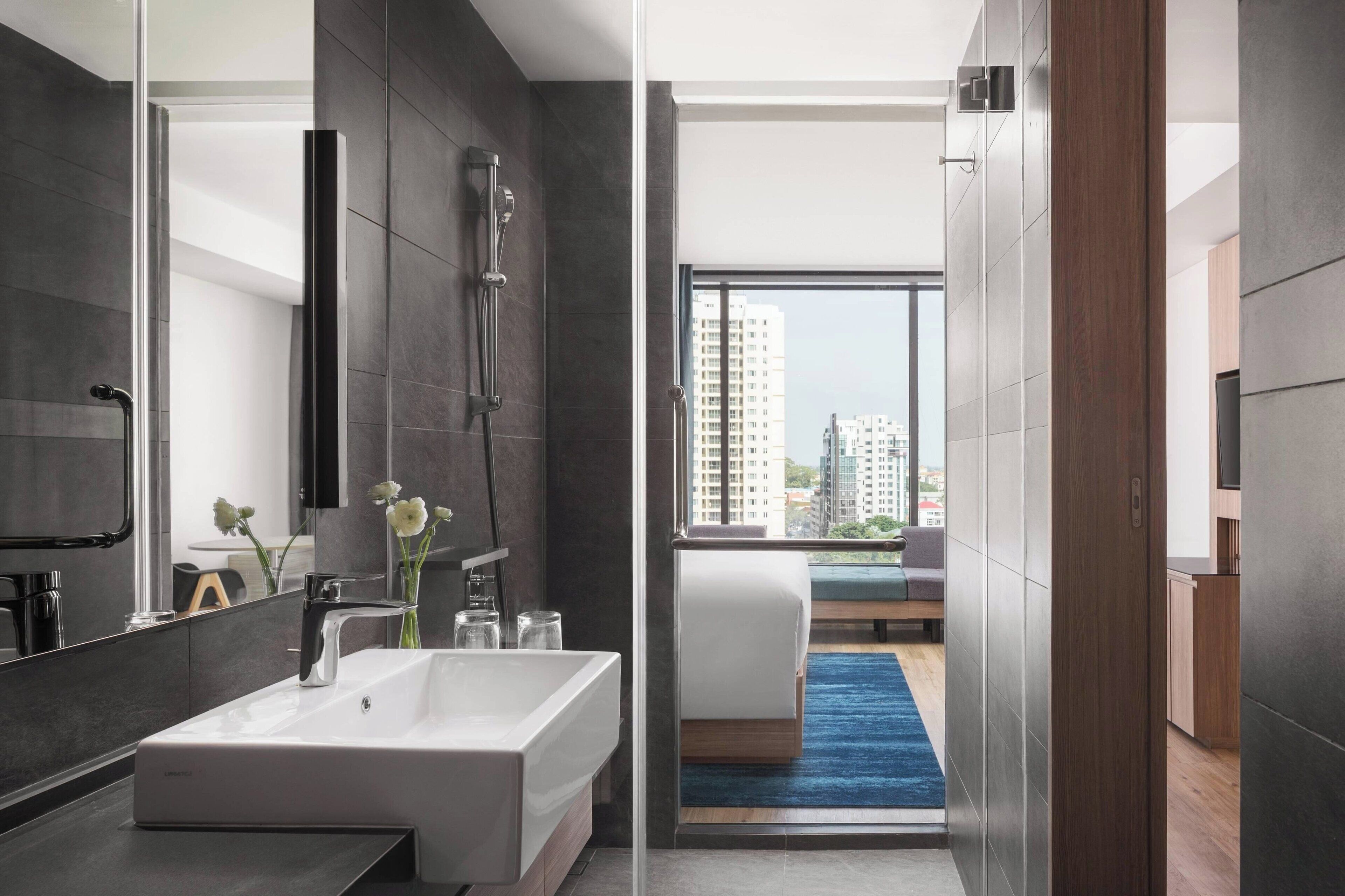 executive suite, 1 king bed with sofa bed, non smoking | bathroom | shower, rainfall showerhead, free toiletries, hair dryer