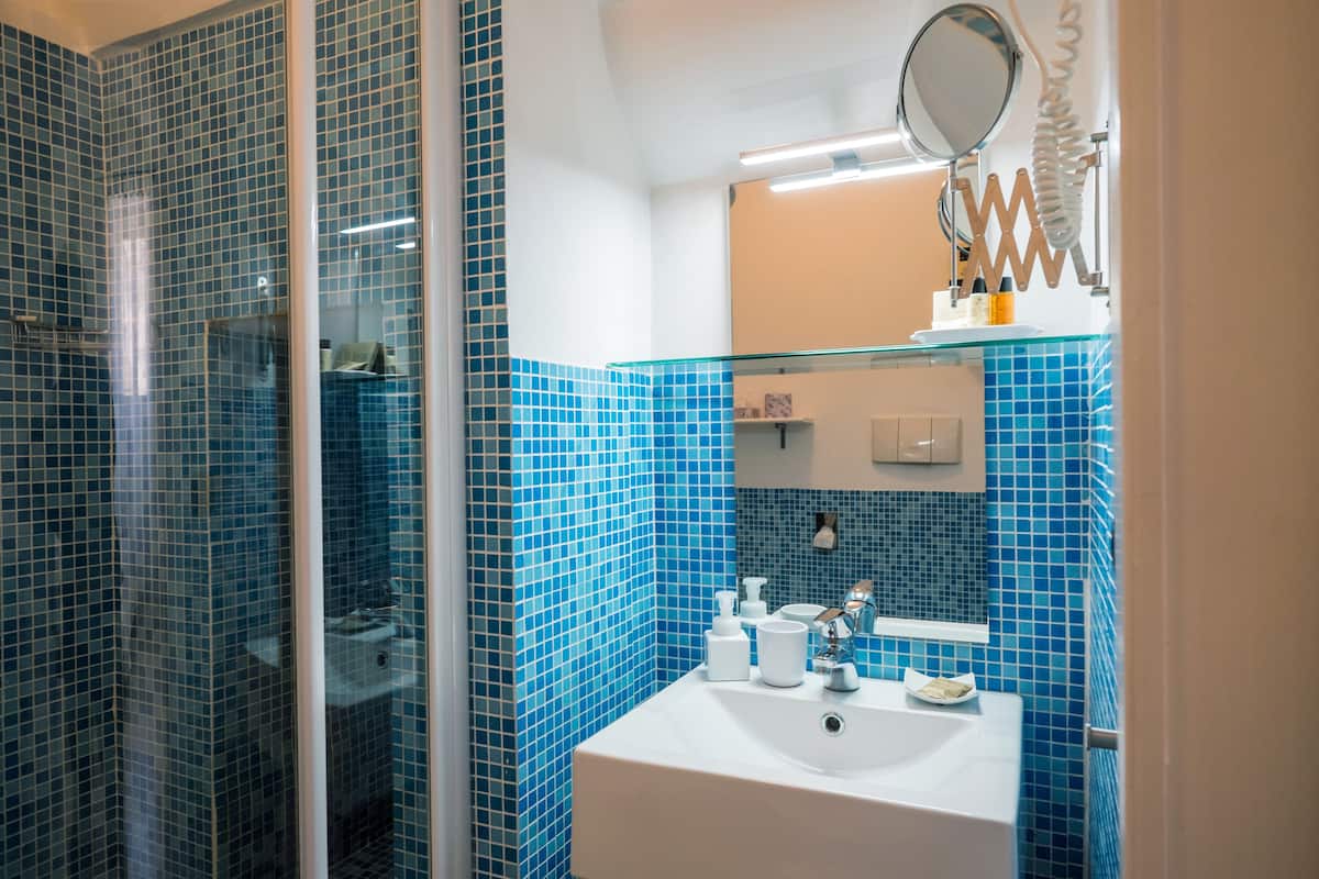 superior double or twin room | bathroom | shower, free toiletries, hair dryer, slippers
