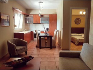 Superior Apartment, 2 Bedrooms, Sea View (2 Adults + 2 Children) | Living area | Flat-screen TV
