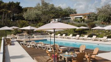 Outdoor pool, open 9:00 AM to 8:00 PM, pool umbrellas, pool loungers