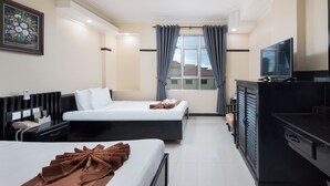 A hotel room with two beds, a TV, a desk, and a window with curtains. - Salita Hotel (Phnom Penh)